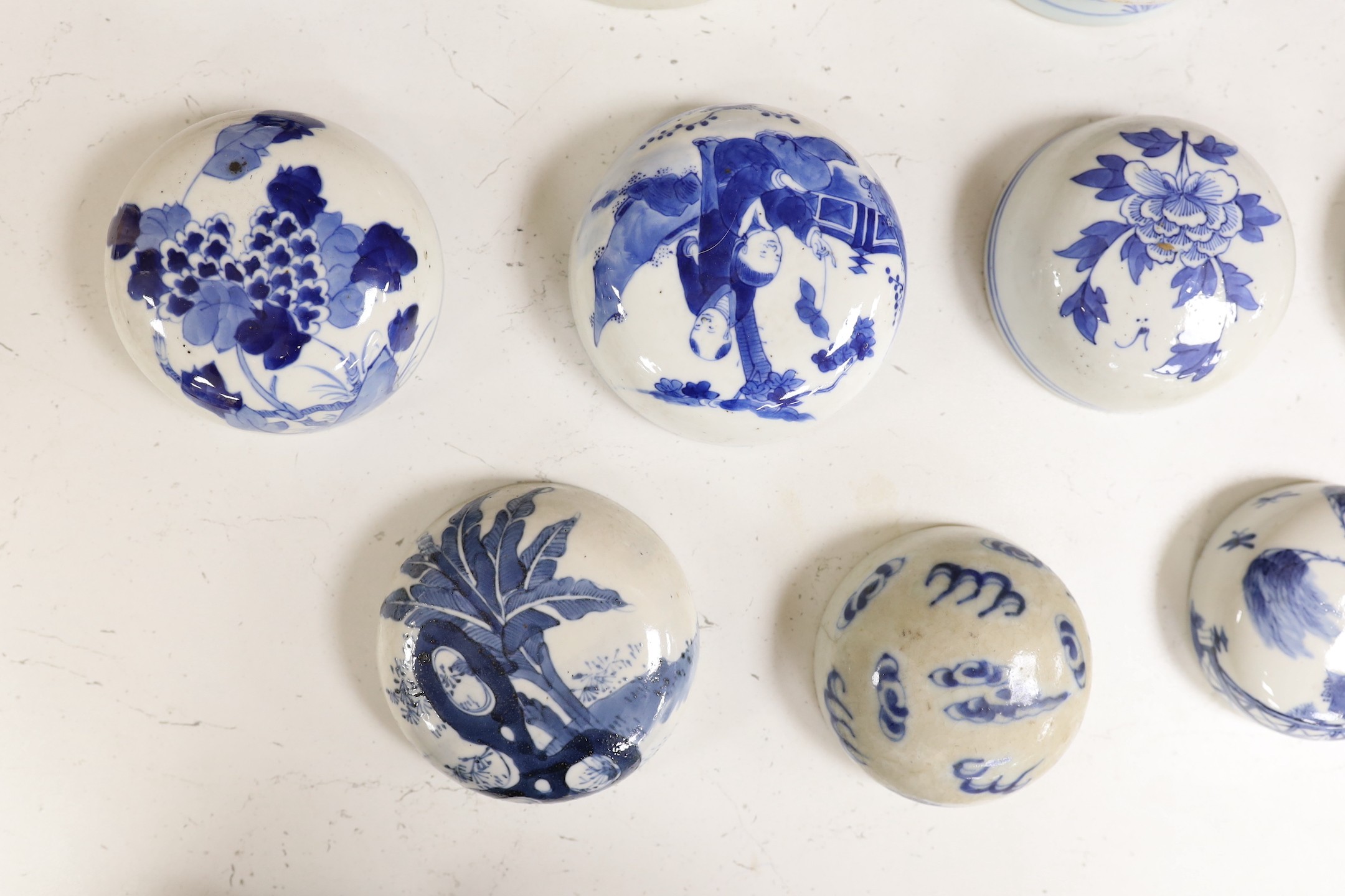 Fifteen 18th/19th century Chinese blue and white jar covers, largest 13.3cm diameter, Provenance - D.C.Monk & Son, former dealers based in Kensington Church Street, London W8